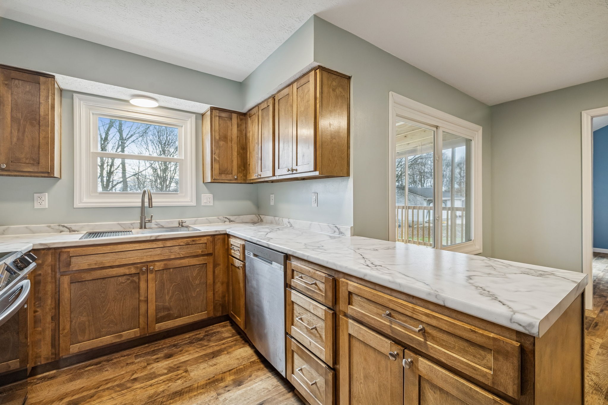 179 West Hester Road Cottontown, TN 37048 - Photo 15 of 43 a kitchen with granite countertop cabinets stainless steel appliances a sink and a window