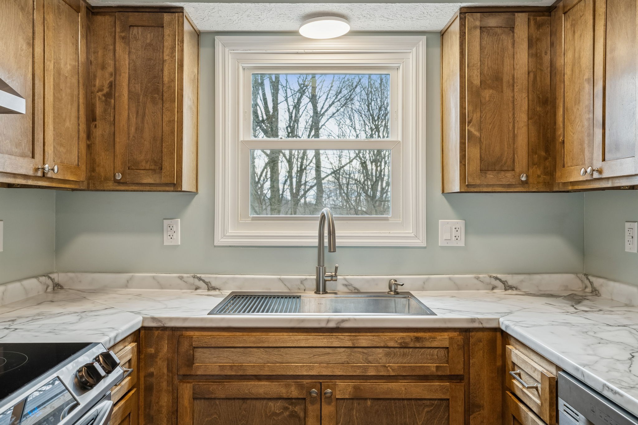 179 West Hester Road Cottontown, TN 37048 - Photo 16 of 43 a kitchen with a sink cabinets and window