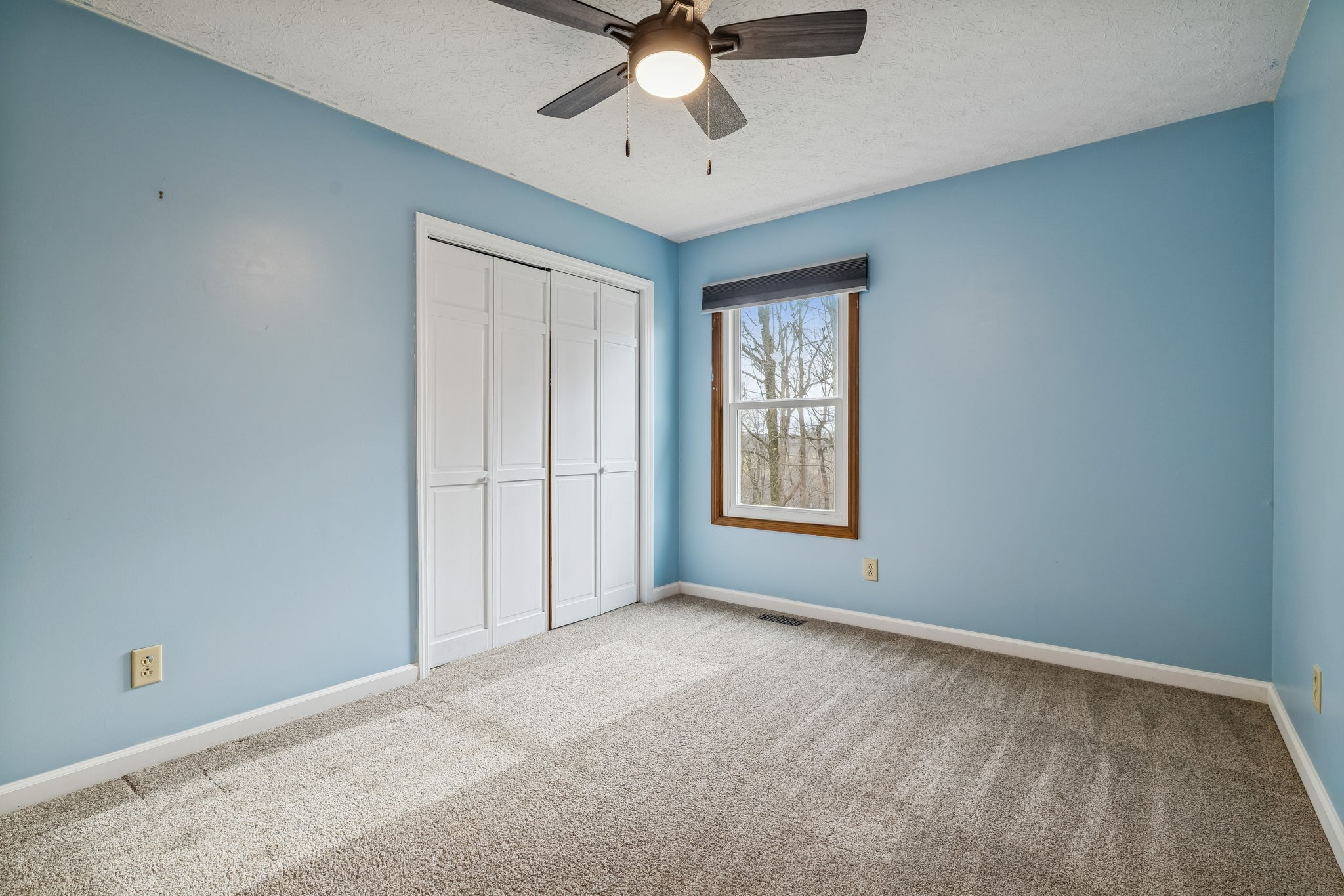 179 West Hester Road Cottontown, TN 37048 - Photo 30 of 43 an empty room with chandelier fan and windows