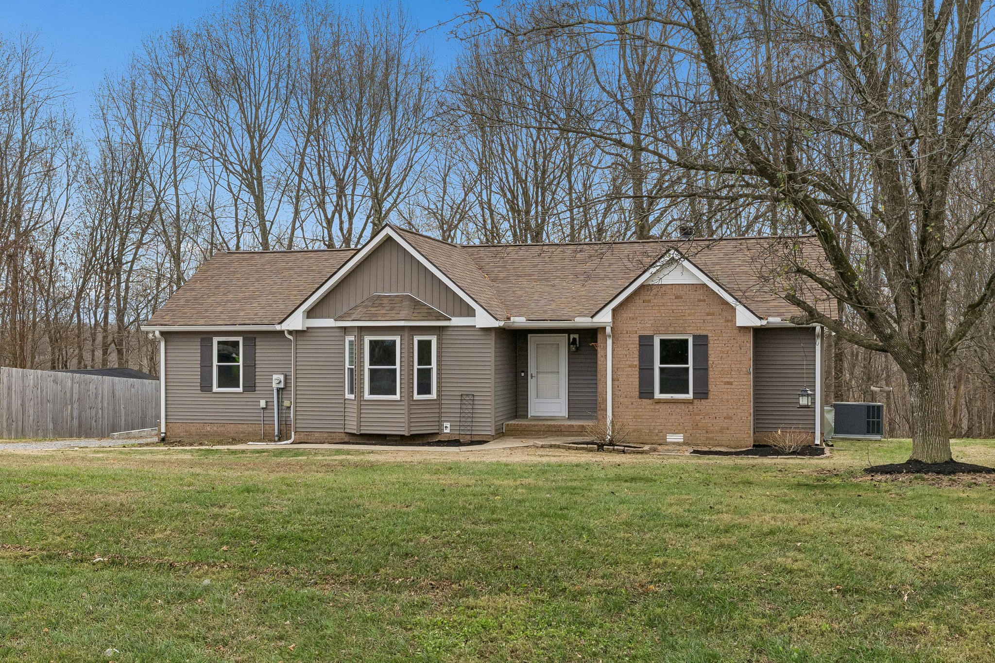 179 West Hester Road Cottontown, TN 37048 - Photo 34 of 43 a front view of house with yard and trees