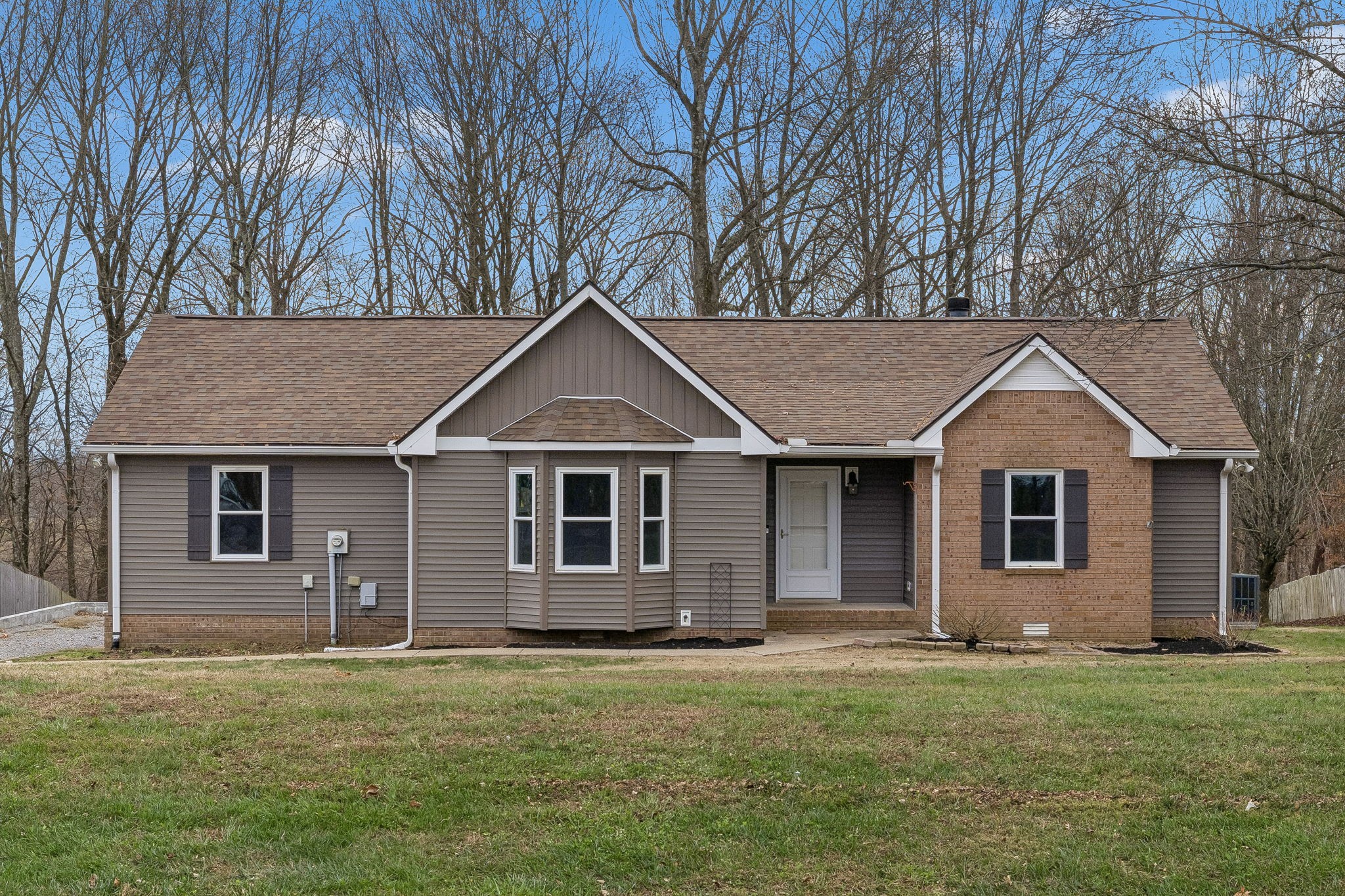 179 West Hester Road Cottontown, TN 37048 - Photo 35 of 43 a front view of a house with a garden