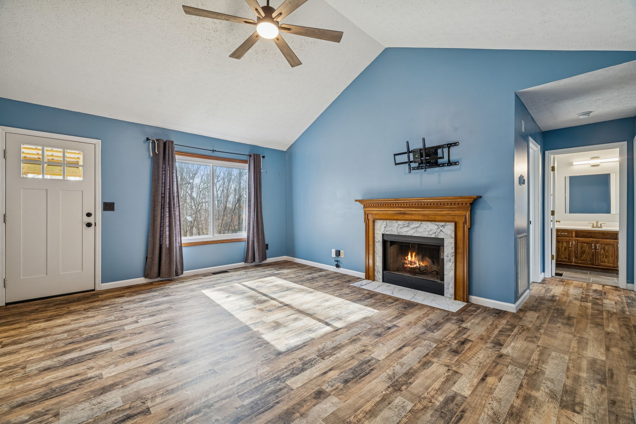 179 West Hester Road Cottontown, TN 37048 - Photo 9 of 43 a view of a livingroom with a fireplace and window