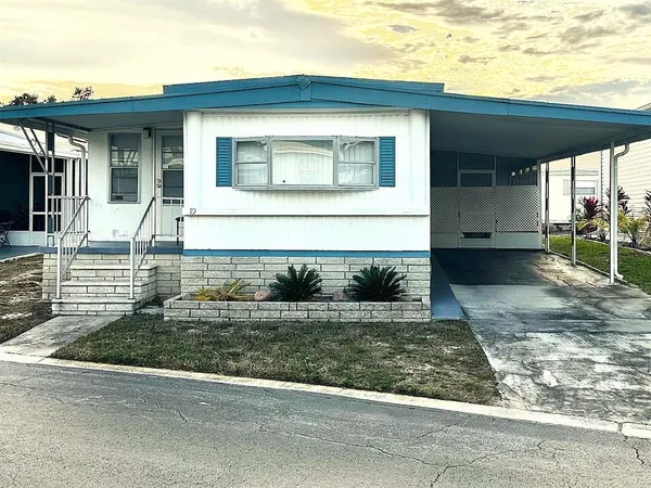 a front view of a house with garage