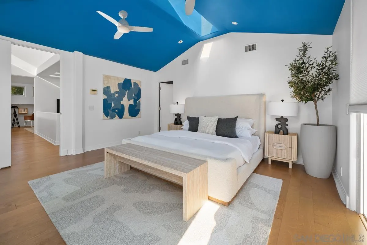 6172 Via Posada Del Norte Rancho Santa Fe, CA 92067 - Photo 14 of 23 a bedroom with a large bed and a chandelier