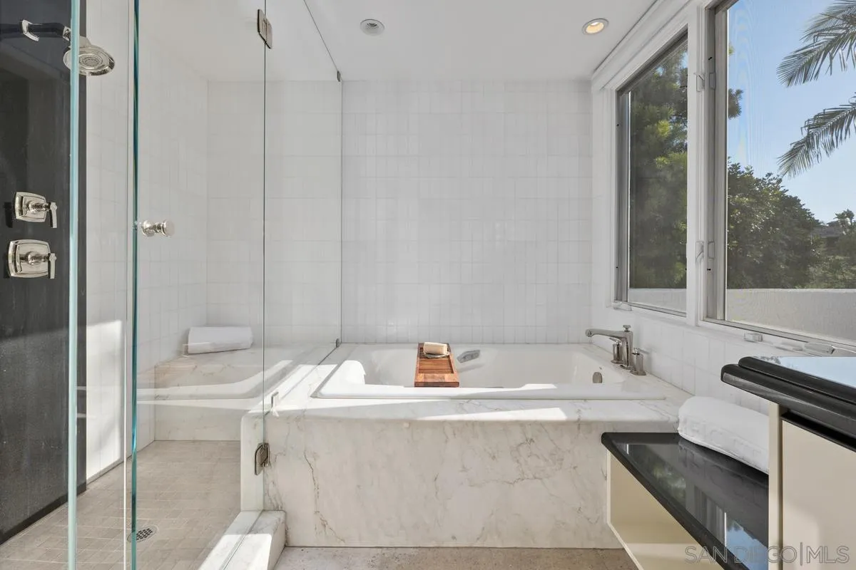 6172 Via Posada Del Norte Rancho Santa Fe, CA 92067 - Photo 17 of 23 a bathroom with a tub sink and mirror