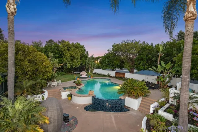 a view of a swimming pool with a patio