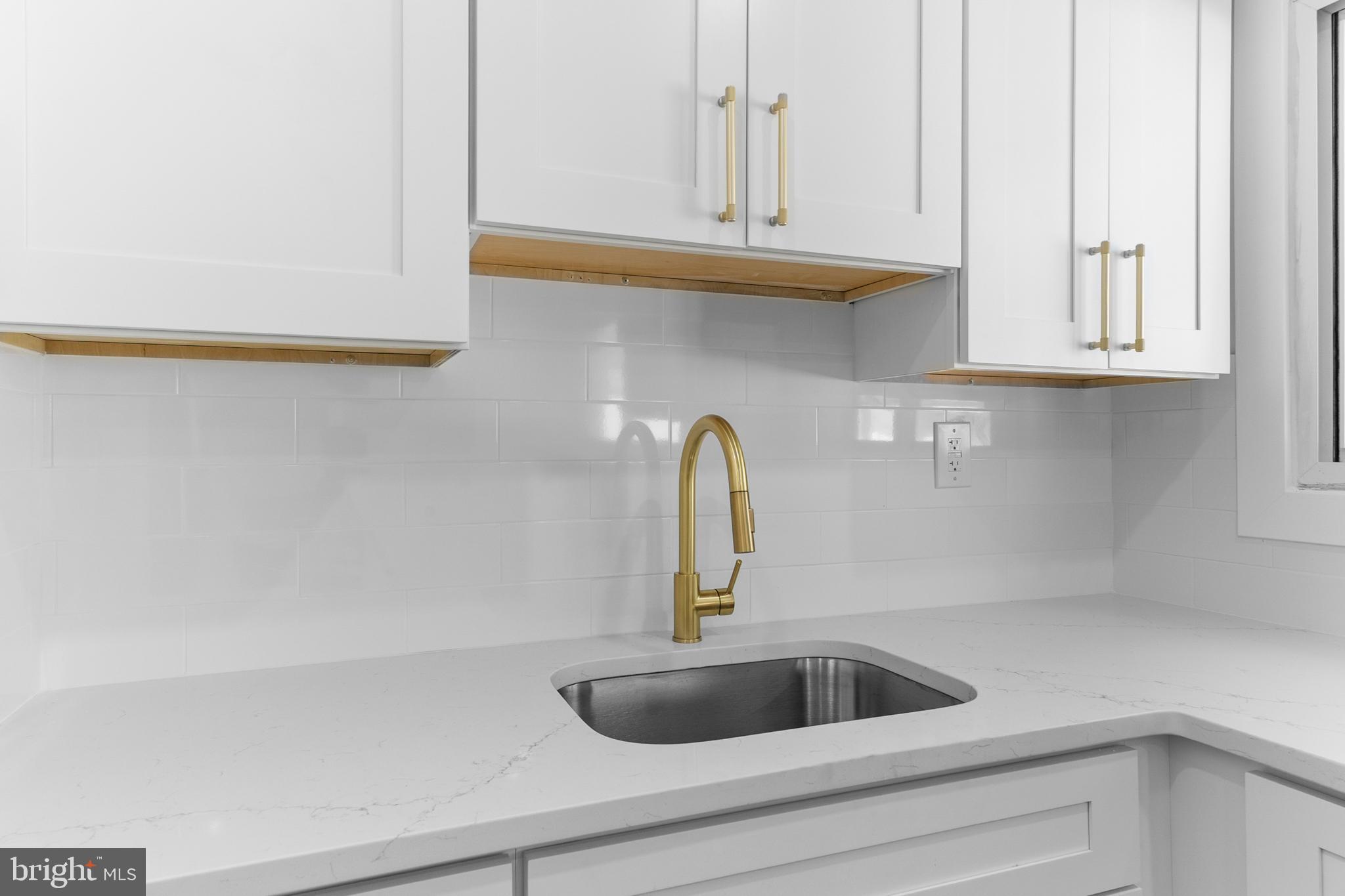 100 Colwick Drive Somers Point, NJ 08244 - Photo 4 of 30 a kitchen with a sink and cabinets