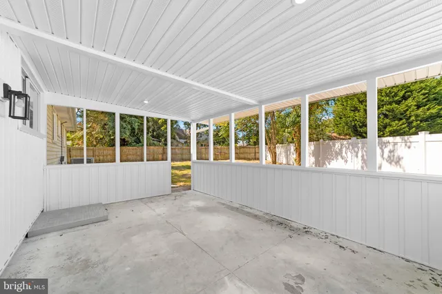 a view of an empty room with a large window