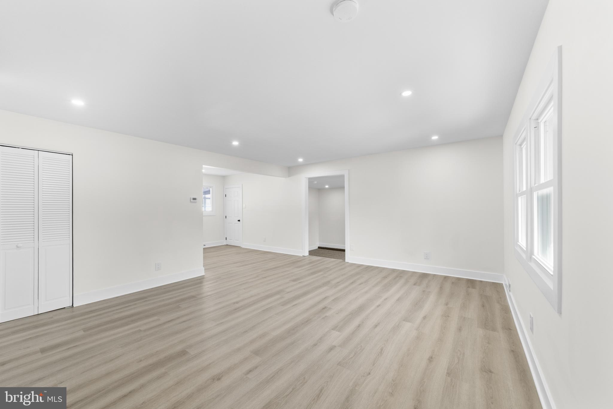 100 Colwick Drive Somers Point, NJ 08244 - Photo 9 of 30 a view of an empty room with wooden floor and a window