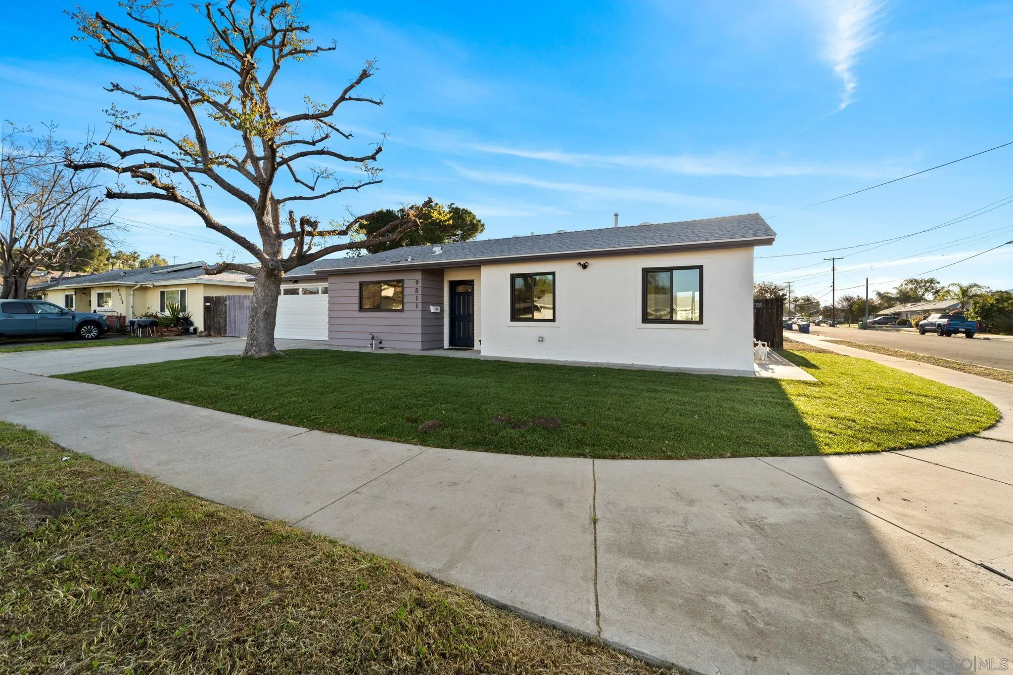 9511 Nicole Way Santee, CA 92071 - Photo 1 of 27 a front view of a house with a yard and garage