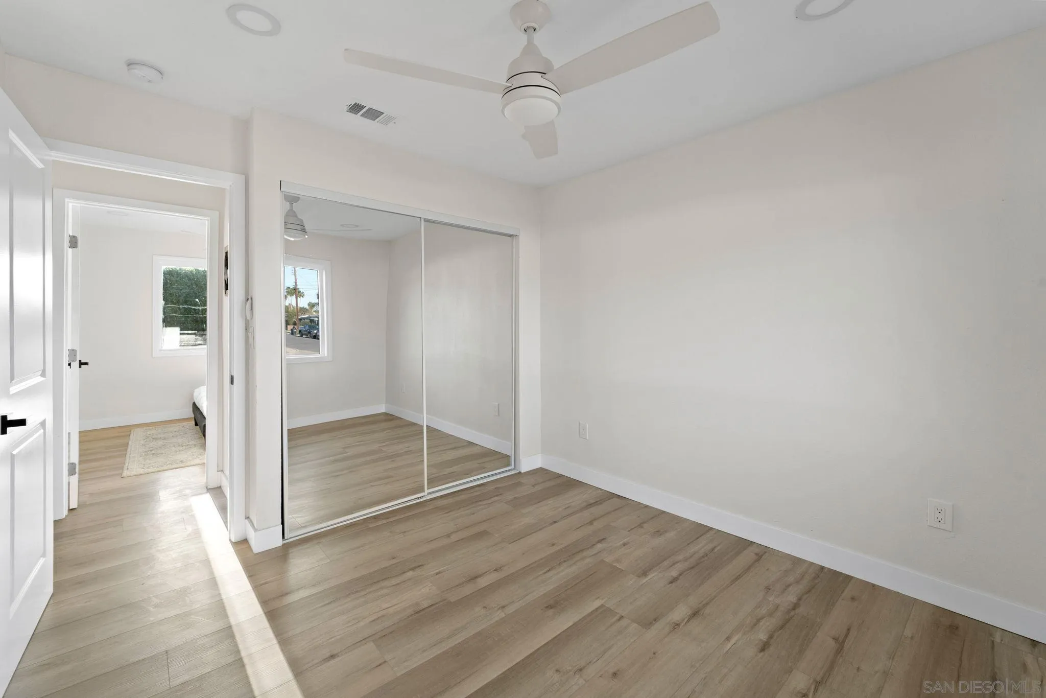 9511 Nicole Way Santee, CA 92071 - Photo 16 of 27 wooden floor in an empty room with a bathroom