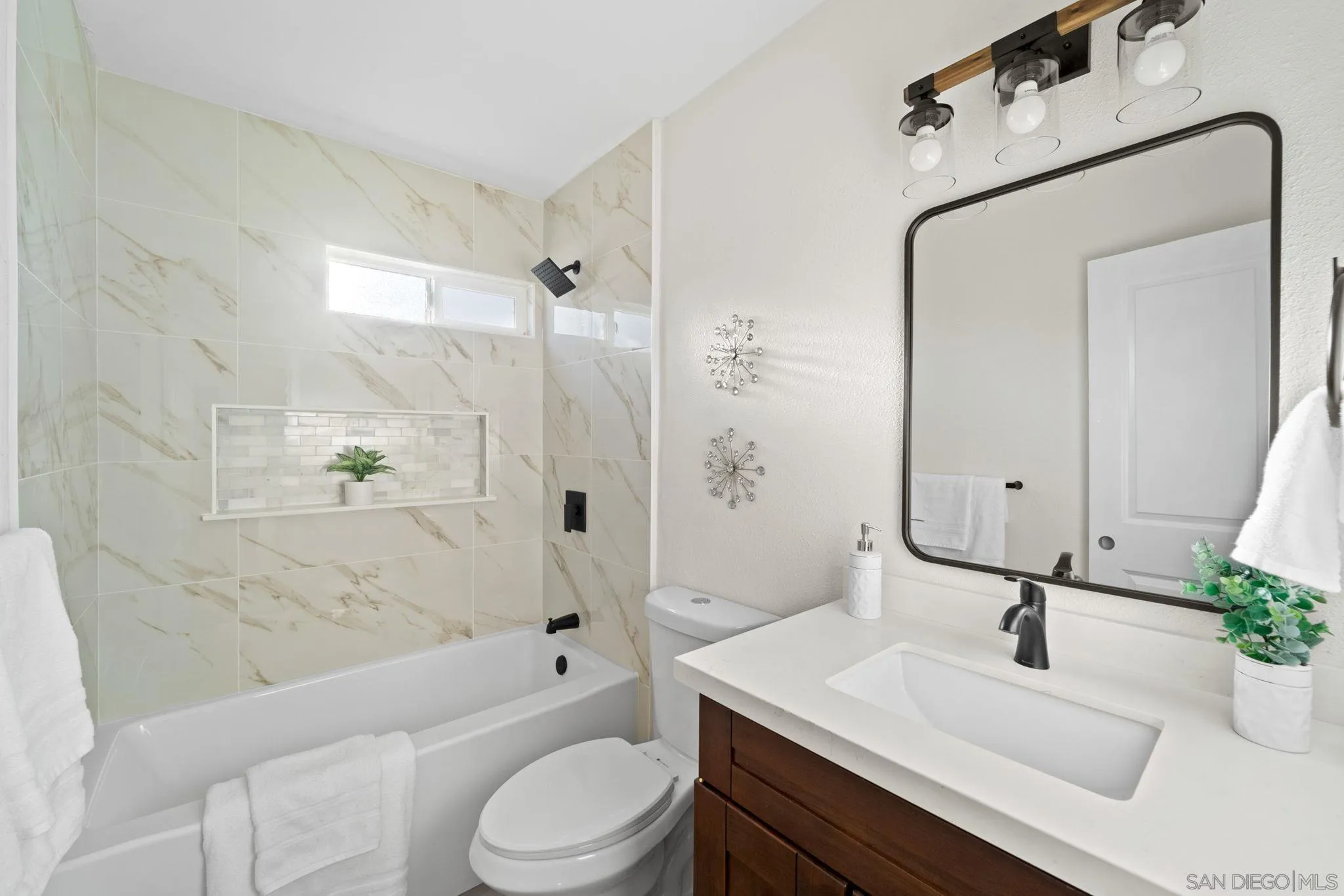 9511 Nicole Way Santee, CA 92071 - Photo 18 of 27 a bathroom with a sink a toilet and shower