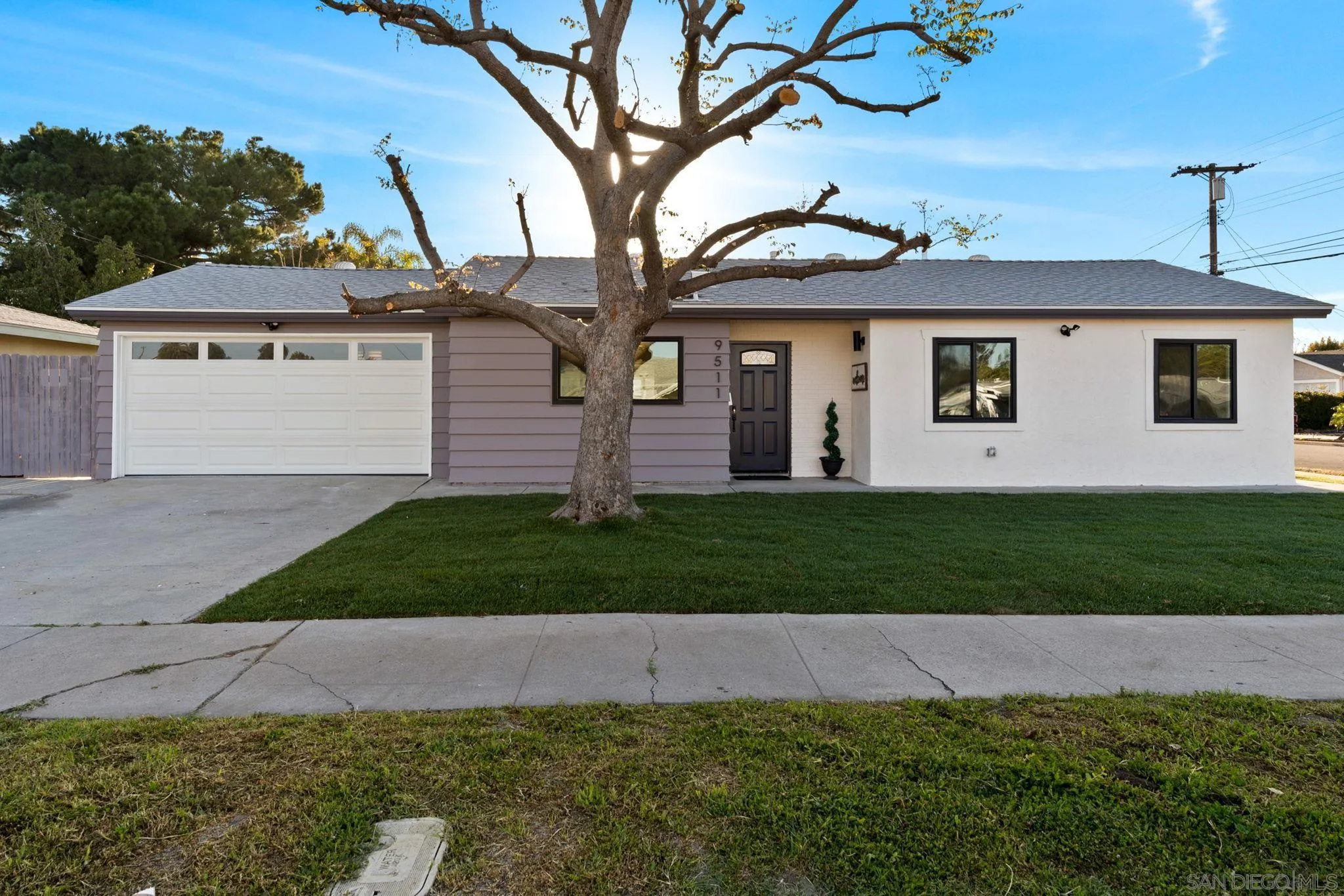 9511 Nicole Way Santee, CA 92071 - Photo 2 of 27 a front view of a house with a garden and yard