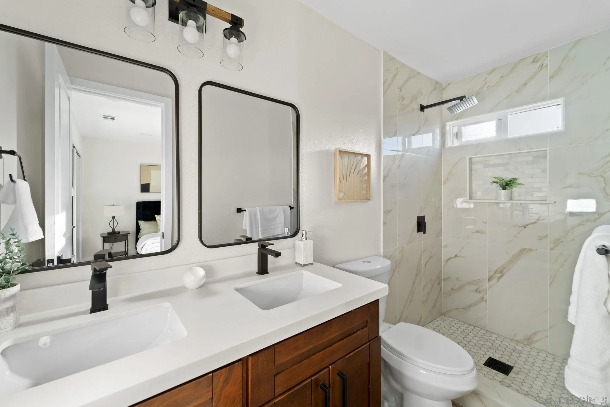 9511 Nicole Way Santee, CA 92071 - Photo 23 of 27 a bathroom with a sink a toilet and shower