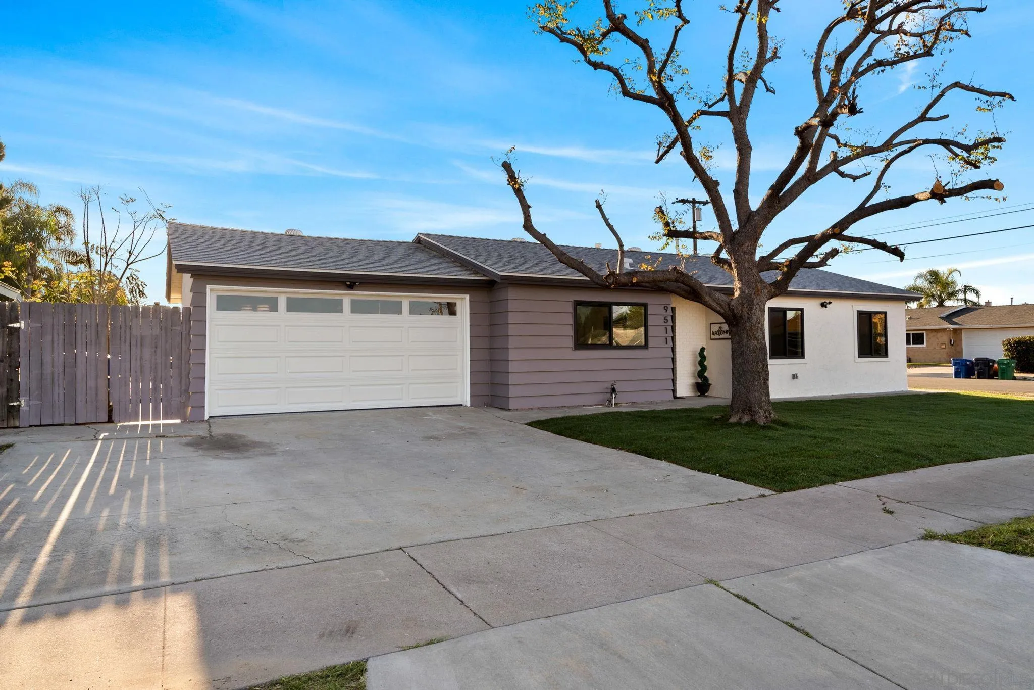 9511 Nicole Way Santee, CA 92071 - Photo 27 of 27 a view of a house with a yard and garage