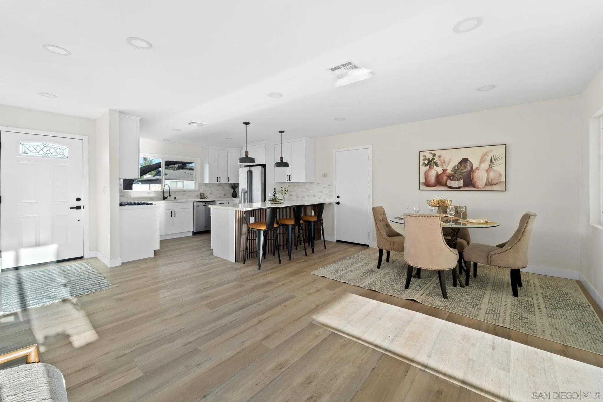 9511 Nicole Way Santee, CA 92071 - Photo 7 of 27 a view of a dining room with furniture and chandelier