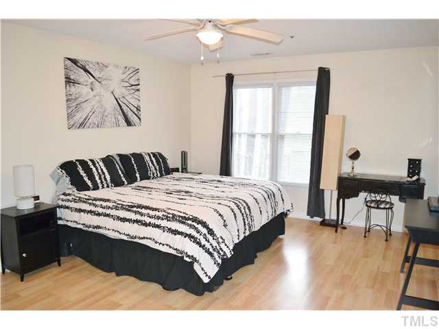 930 Springfork Drive Cary, NC 27513 - Photo 10 of 23 Huge master suite with ceiling fan, private bath, and walk-in closet.