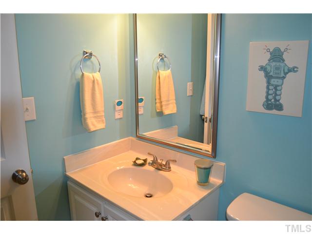 930 Springfork Drive Cary, NC 27513 - Photo 15 of 23 Second full bath with brushed nickel fixtures and hardware.