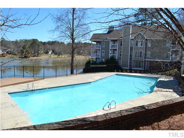 930 Springfork Drive Cary, NC 27513 - Photo 19 of 23 Beautiful view from the clubhouse! Pool overlooking the pond...