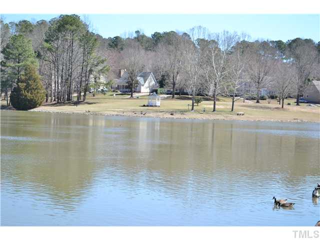 930 Springfork Drive Cary, NC 27513 - Photo 22 of 23 Take a break and relax in the gazebo overlooking the pond.