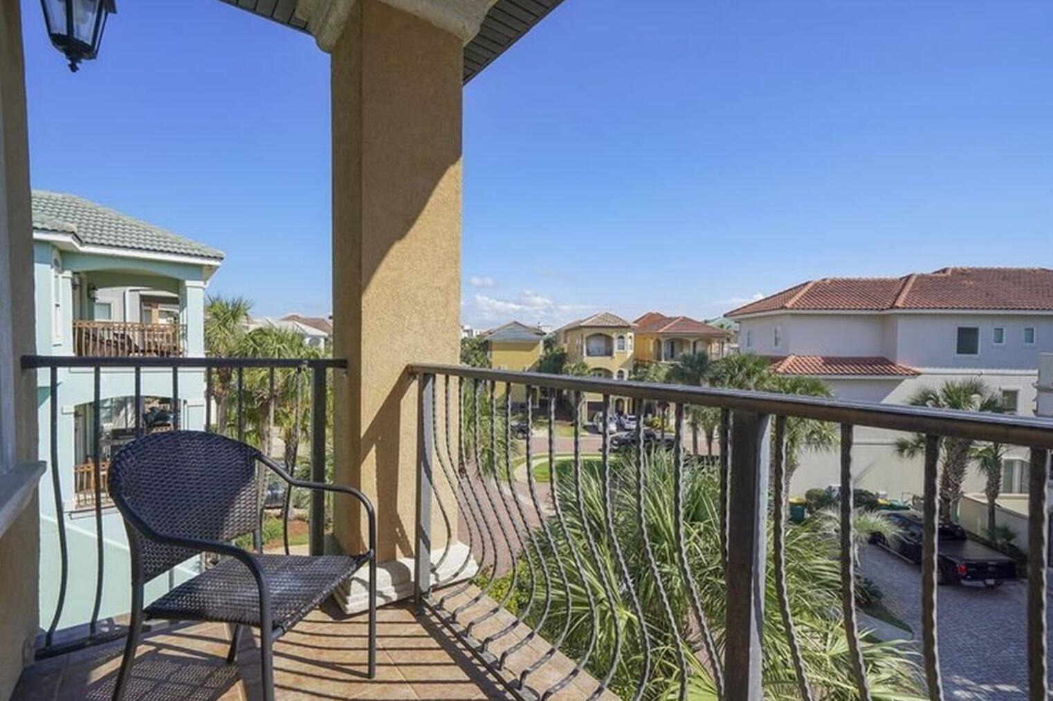 4836 Ocean Boulevard Destin, FL 32541 - Photo 13 of 44 a view of a balcony with chairs