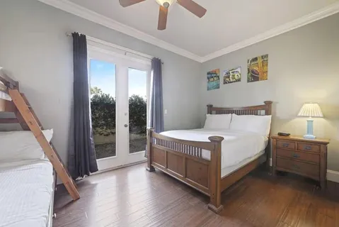 a bedroom with a bed and a mirror