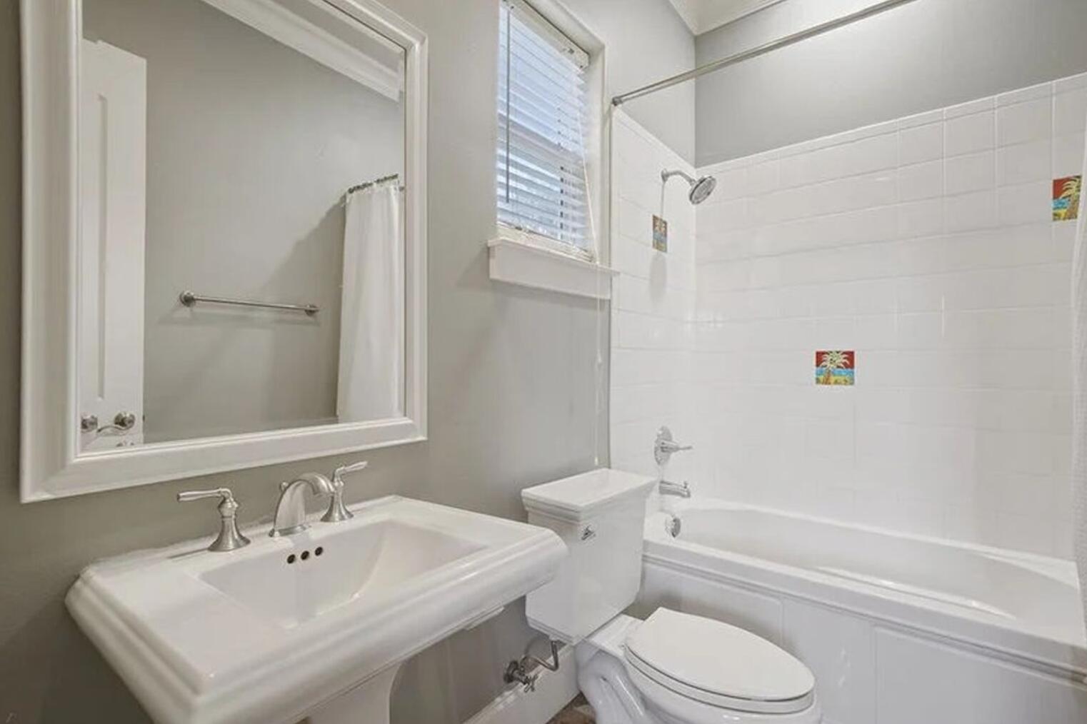 4836 Ocean Boulevard Destin, FL 32541 - Photo 16 of 44 a bathroom with a sink toilet and shower