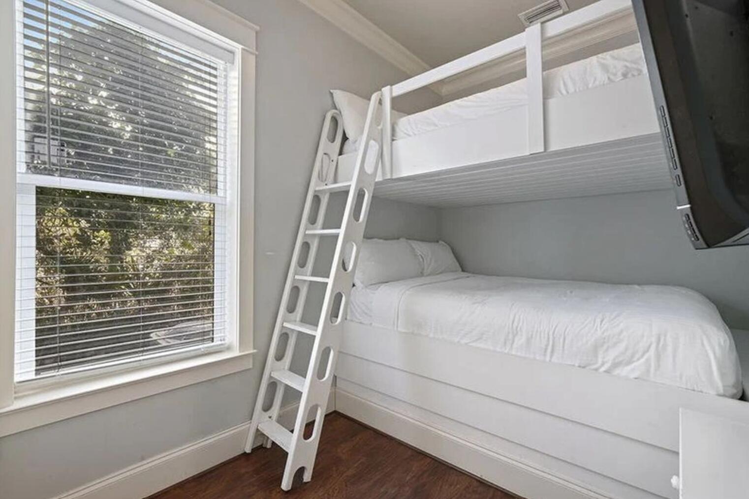 4836 Ocean Boulevard Destin, FL 32541 - Photo 17 of 44 a bedroom with a bed and a window with wooden floor