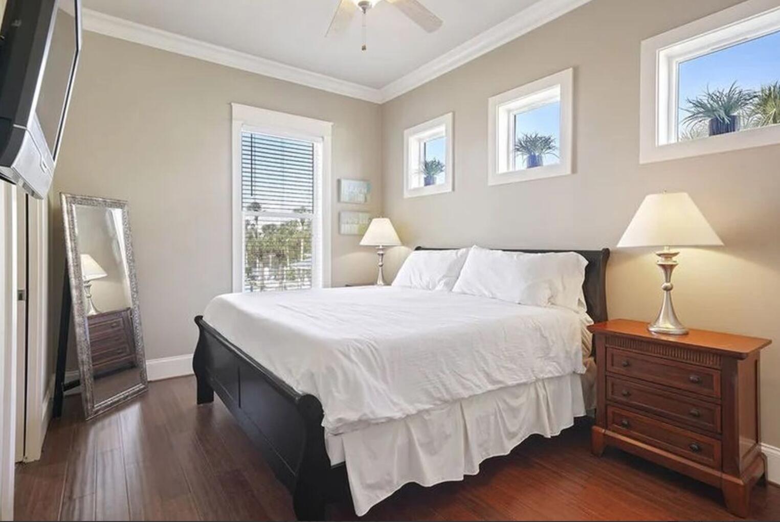 4836 Ocean Boulevard Destin, FL 32541 - Photo 19 of 44 a bedroom with a bed and a night stand