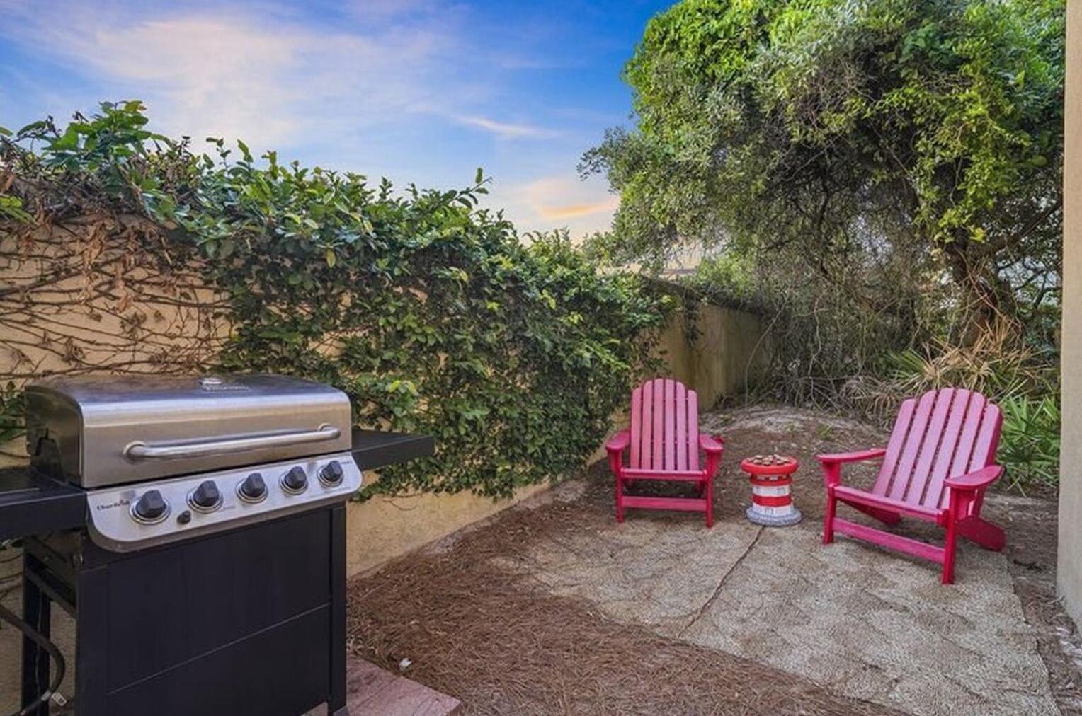 4836 Ocean Boulevard Destin, FL 32541 - Photo 25 of 44 a view of a back yard with a bench