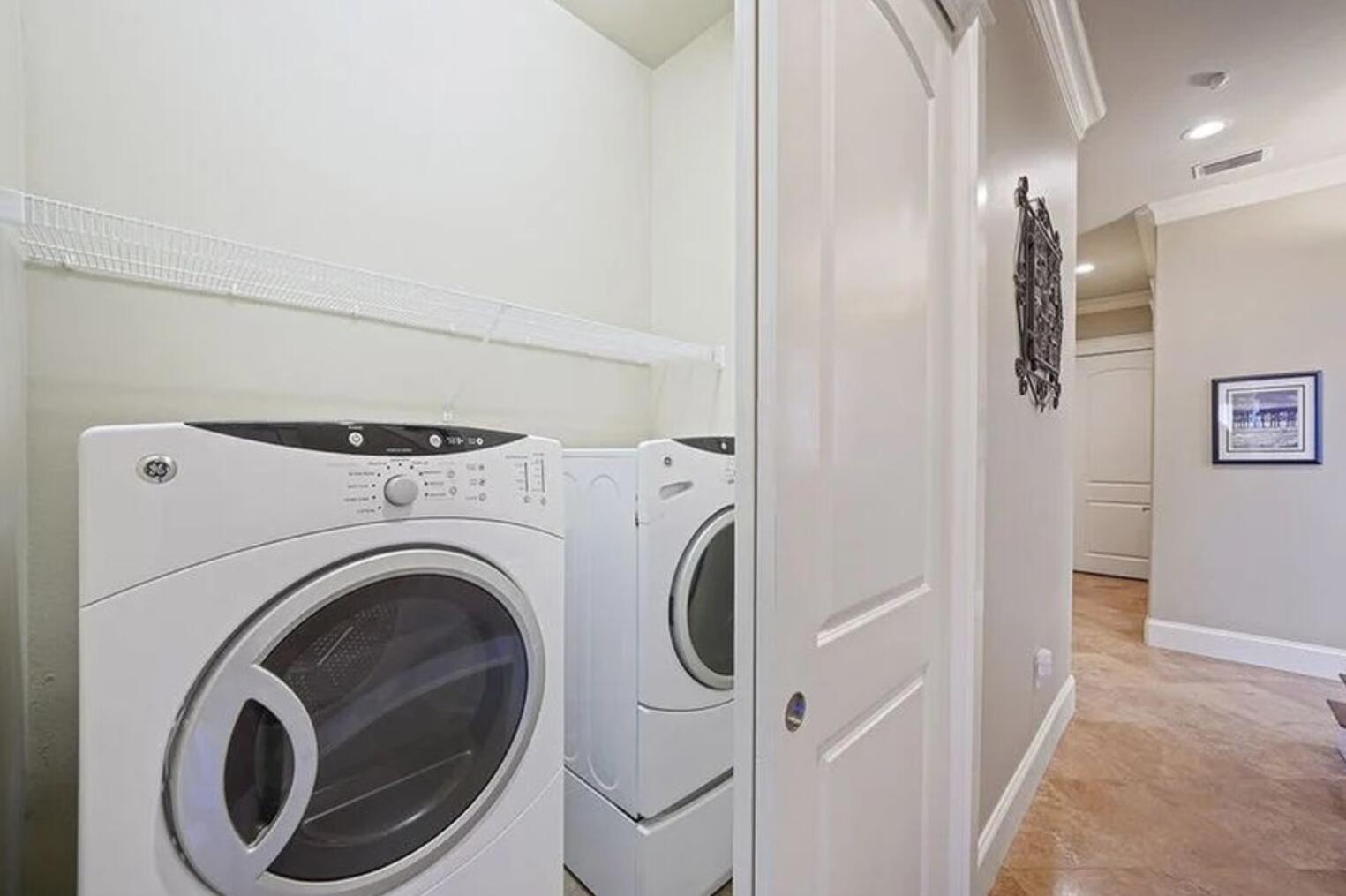 4836 Ocean Boulevard Destin, FL 32541 - Photo 26 of 44 a view of a hallway with washer and dryer