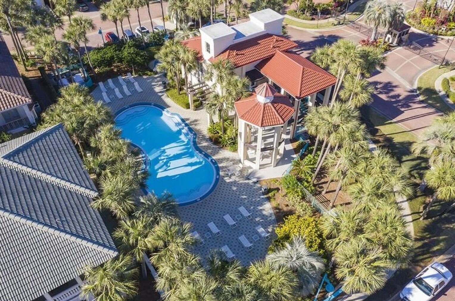 4836 Ocean Boulevard Destin, FL 32541 - Photo 40 of 44 a aerial view of a house with yard and outdoor seating