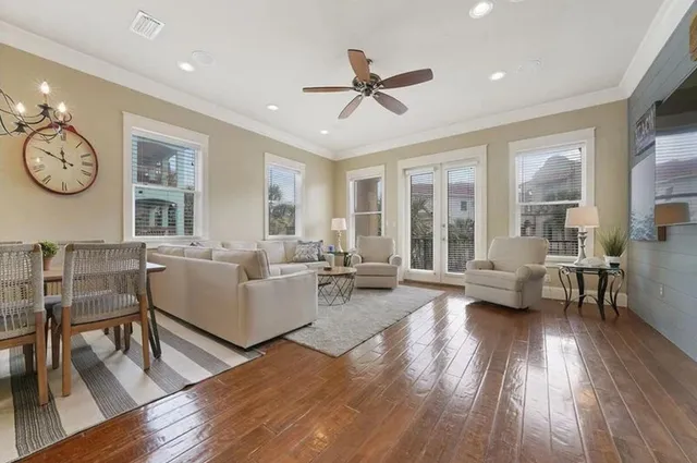 a kitchen with stainless steel appliances granite countertop a stove refrigerator a sink dishwasher with a dining table and chairs