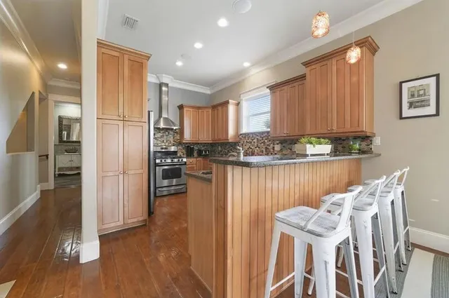 a kitchen with stainless steel appliances granite countertop a sink and cabinets