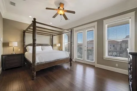 a bathroom with a granite countertop sink a large mirror and a bathtub