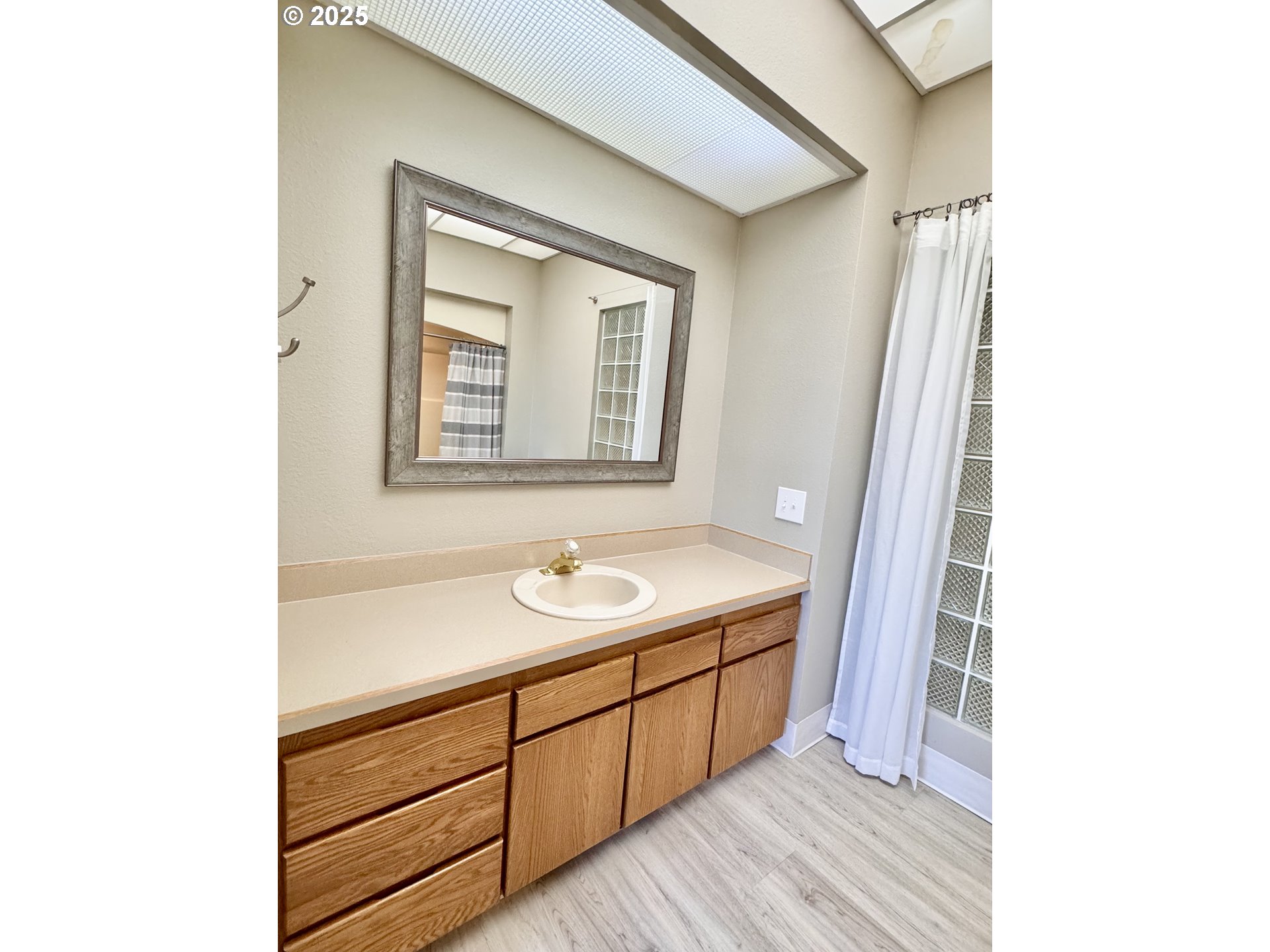 2365 4th Street, Unit 205 Baker City, OR 97814 - Photo 15 of 23 a bathroom with a sink and a mirror