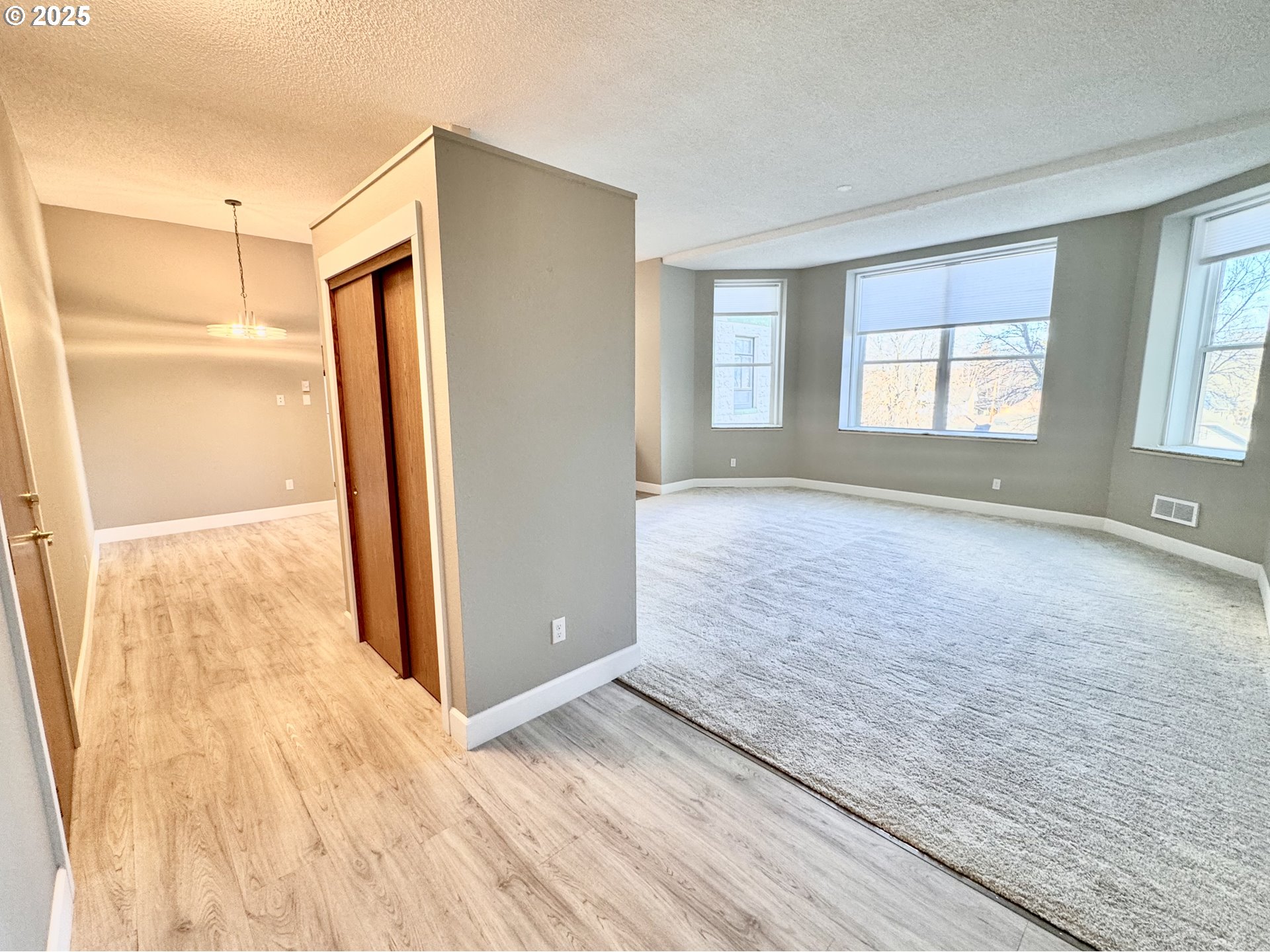 2365 4th Street, Unit 205 Baker City, OR 97814 - Photo 7 of 23 wooden floor in an empty room with a window