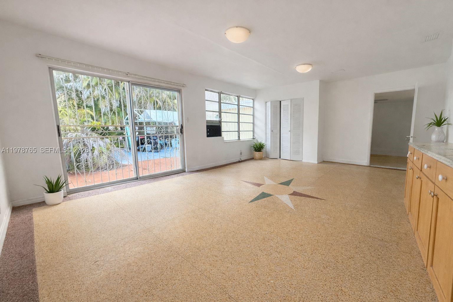 2227 Southwest 2nd Terrace, Unit 2227 Miami, FL 33135 - Photo 2 of 10 a view of an empty room with a window
