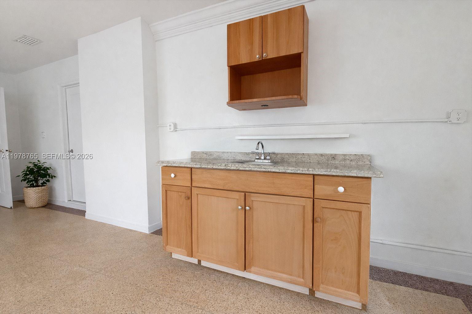 2227 Southwest 2nd Terrace, Unit 2227 Miami, FL 33135 - Photo 3 of 10 a bathroom with a sink and a mirror