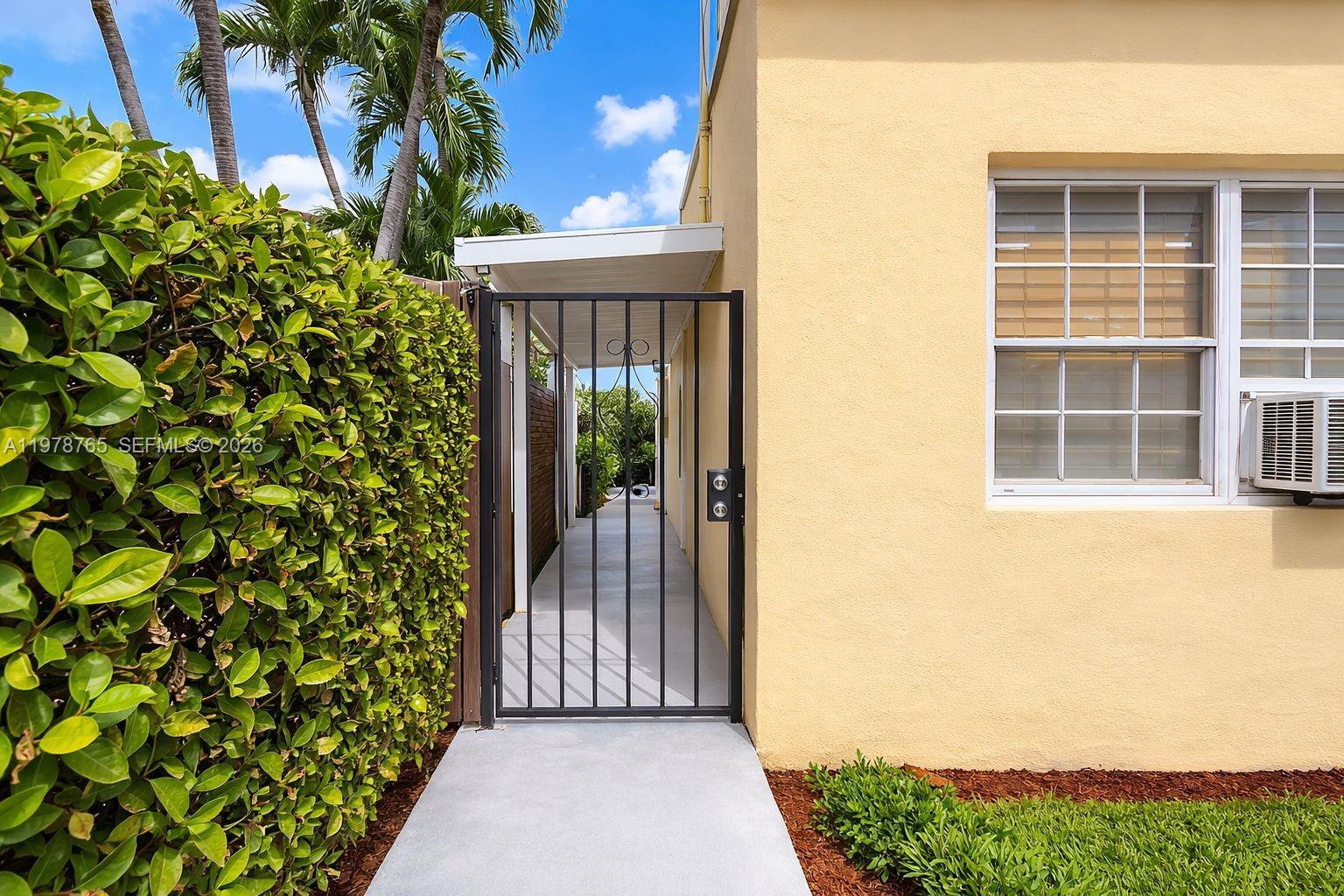 2227 Southwest 2nd Terrace, Unit 2227 Miami, FL 33135 - Photo 9 of 10 a view of a brick house with a large window