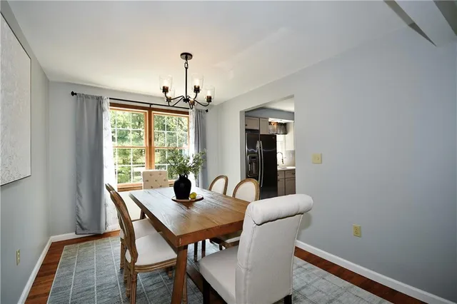 a view of a dining room with furniture window and outside view