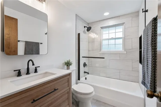 a bathroom with a sink a toilet and a bathtub
