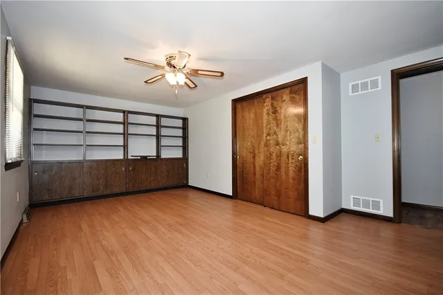 a view of workspace with wooden floor and window