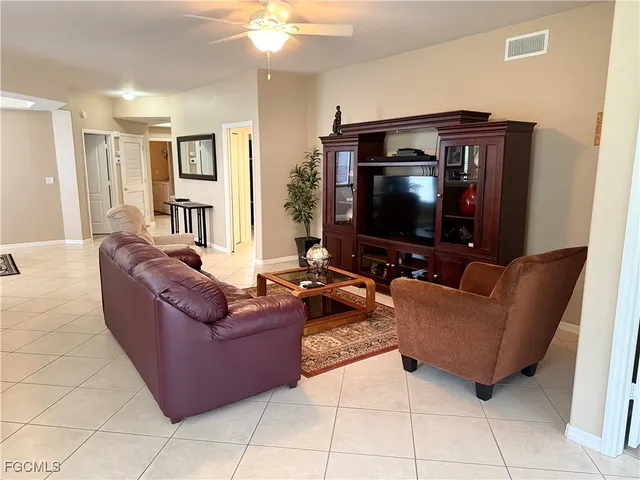 a bedroom with a bed lamp and window