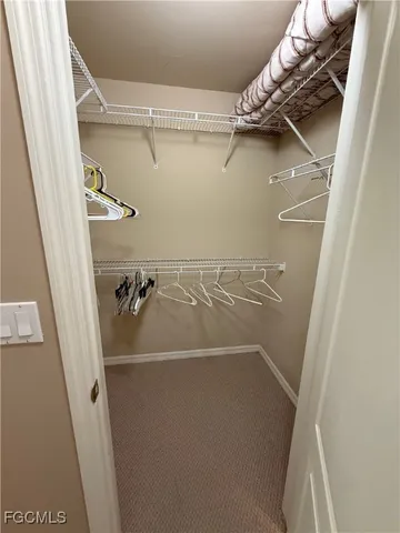 a bathroom with a double vanity sink a mirror and a shower