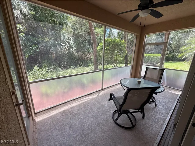 an aerial view of a house with a yard and potted plants
