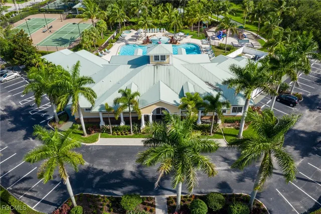 an aerial view of a house with a yard and garden