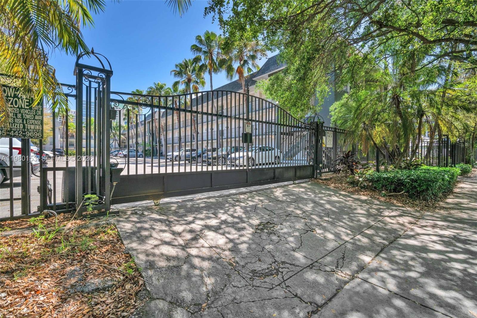 3245 Virginia Street, Unit 39 Miami, FL 33133 - Photo 14 of 25 a view of backyard and tree