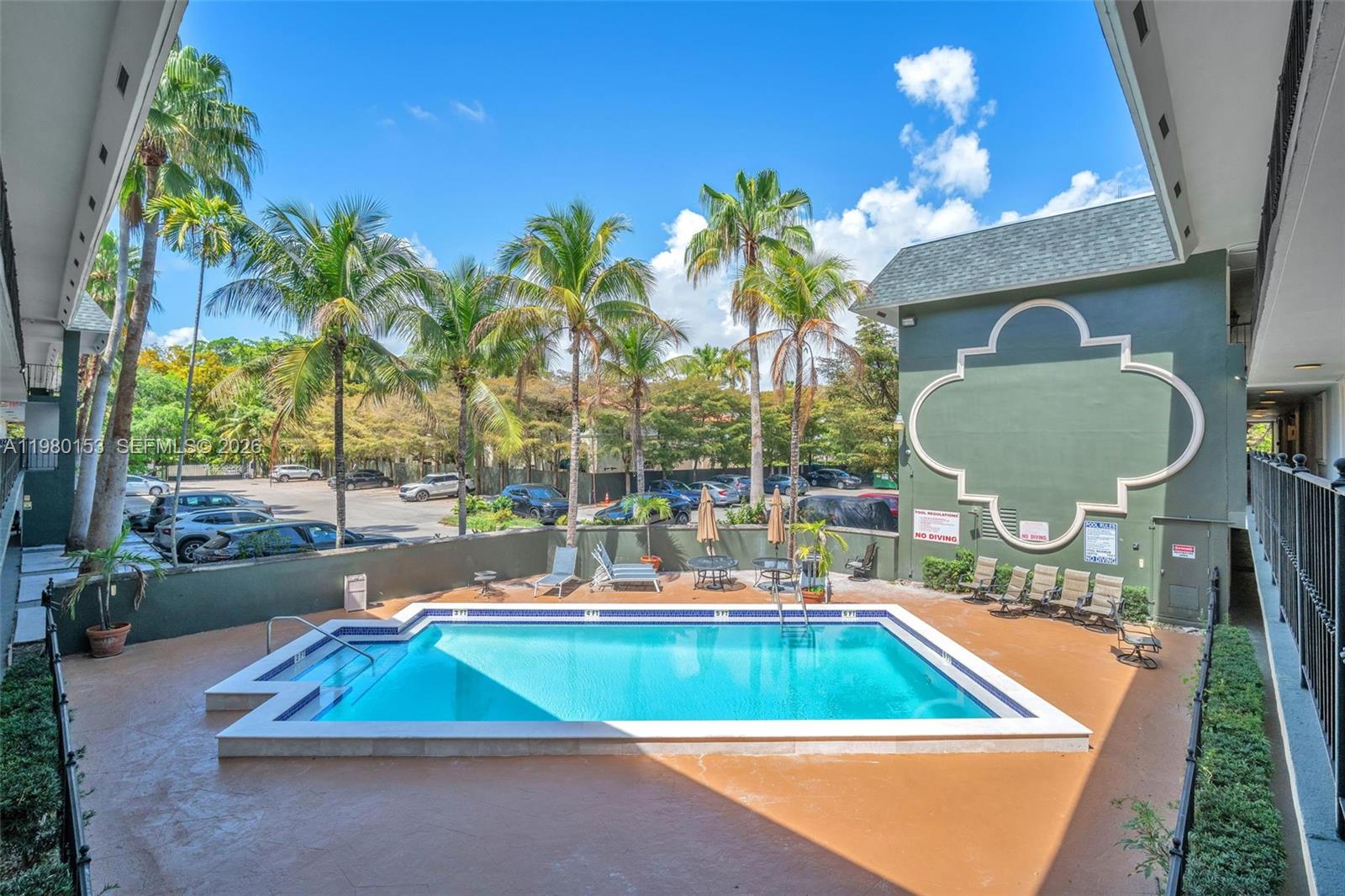 3245 Virginia Street, Unit 39 Miami, FL 33133 - Photo 20 of 25 a view of a chairs and table in the patio