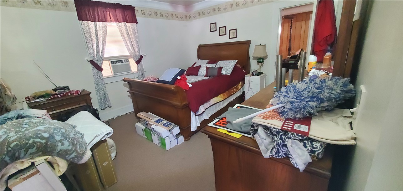114 Hampton Street Pelzer, SC 29669 - Photo 14 of 21 This cozy bedroom offers a peaceful retreat with ample space for rest and relaxation.